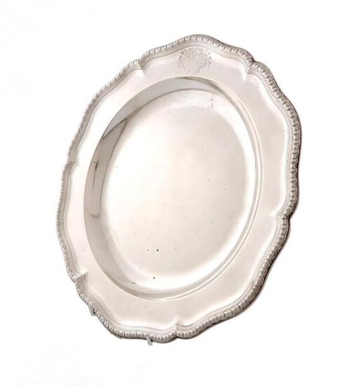 A George II silver second course plate, by Edward Wakelin, London 1754, circular form, stylised border, engraved with an armorial, the underside scratch initialled ~No. 14 31=0~, diameter 30cm, approx. weight 29.3oz. The arms are that of Crompton...
