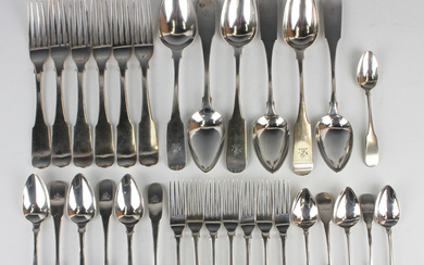 A George III Irish harlequin part canteen of silver Fiddle pattern cutlery, comprising a set of four