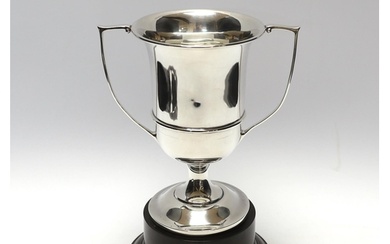 A George V unengraved silver two handled trophy cup, W H Has...