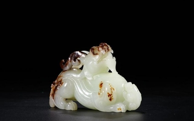 A HETIAN JADE ORNAMENT WITH QILIN SONG ZI SHAPED