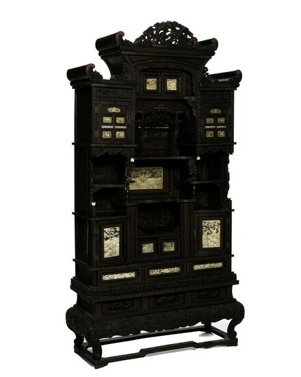 A Japanese carved hardwood cabinet on stand