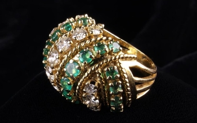 A Large 18 Carat Gold, Diamond and Emerald 'Turban' Ring set with wrythen bands of graduated stones.