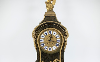 A Louis XV-style cartel clock of black-painted wood decorated with a classical figure and rich gilt decorations, finely chiselled gilt dial with white enamel cartouches and Roman numerals painted in blue, era Napoleon II