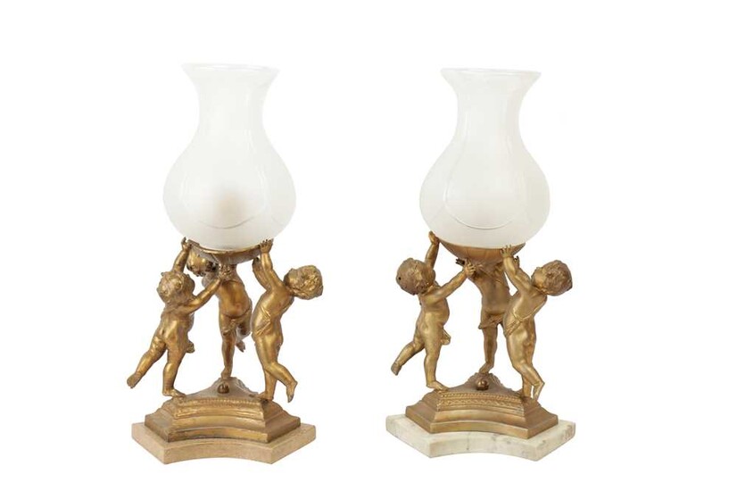 A PAIR OF CONTINENTAL GILT METAL LAMPS, LATE 19TH/20TH CENTURY