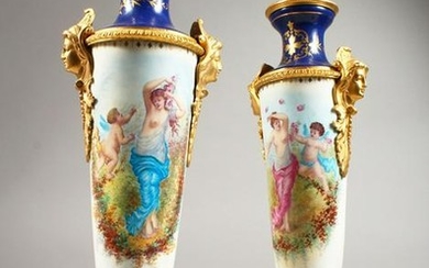 A PAIR OF SEVRES STYLE TALL PORCELAIN VASES painted