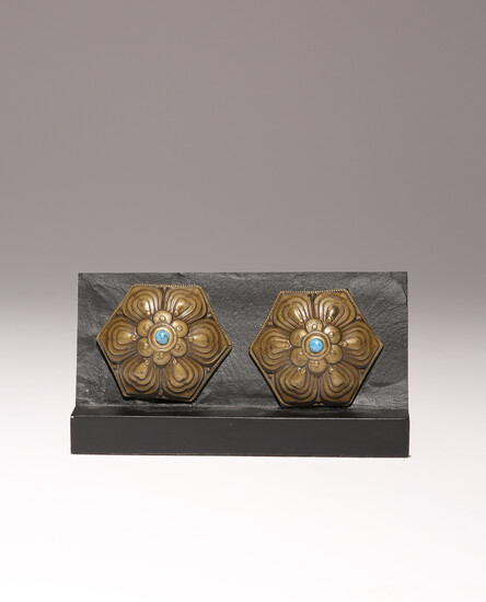 A PAIR OF TIBETAN CAST BRONZE ORNAMENTS INLAID WITH TURQUOISE