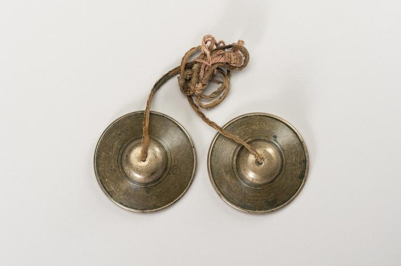 A PAIR OF TWO SMALL TIBETIAN RITUAL CYMBALS