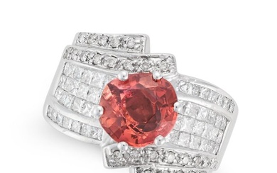 A PINK TOURMALINE AND DIAMOND DRESS RING set with a round cut pink tourmaline accented by round