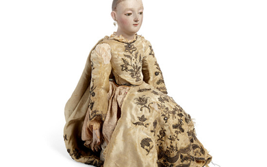 A Polychromed Carved Wood and Silver Embroidered Silk Figure Of Santa Ana