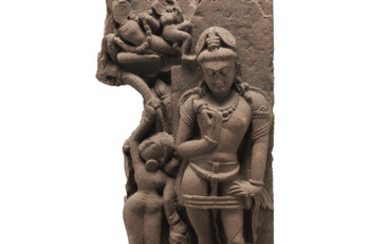 A RED SANDSTONE STELE OF A MALE DEITY INDIA, RAJASTHAN OR MADHYA PRADESH, POST-GUPTA PERIOD, 8TH CENTURY