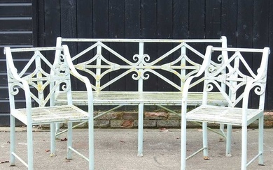 A Regency style cast iron garden set, with a strapwork...