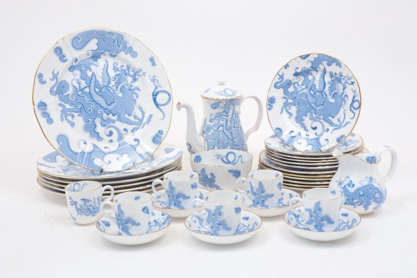 A Royal Worcester blue dragon pattern part coffee and dessert service, with date marks for 1885, comprising: a coffee pot with cover, 19cm high, a creamer, 10cm high, a sugar bowl, 11cm diameter, six coffee cans with saucers, the cans 5.5cm...