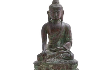 A Tibetan bronze figure of Buddha