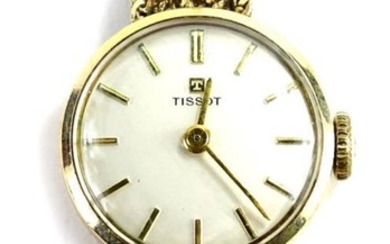 A Tissot ladies 9ct gold wristwatch, with gold strap,...