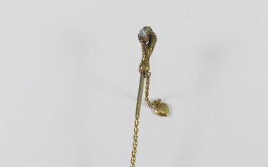 A VICTORIAN ROSE DIAMOND AND GOLD 'CLAW' STICK-PIN