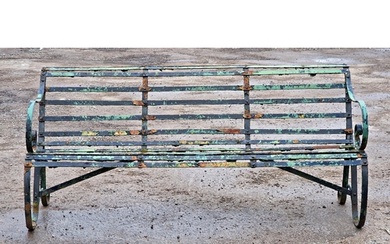 A Victorian iron strapwork three seat garden bench with dist...