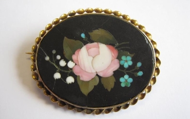 A Victorian pietra dura Brooch depicting flowers in yellow...