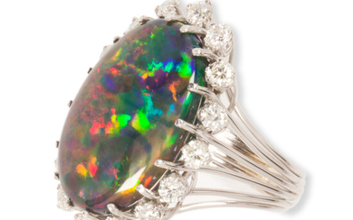 A black opal, diamond and eighteen karat white gold ring