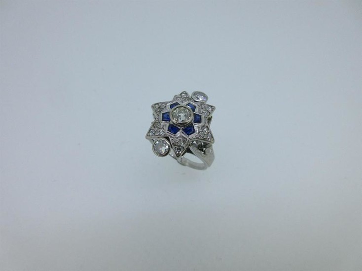 A diamond and sapphire star ring