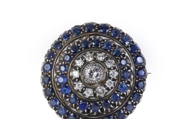 A diamond and sapphire target brooch/pendant