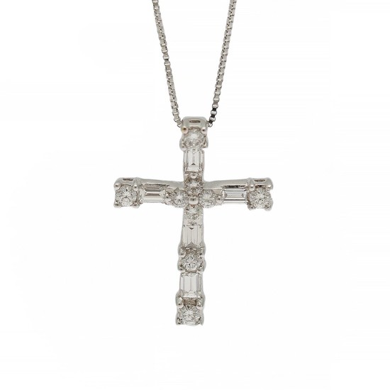 A diamond pendant in the shape of a cross set with numerous baguette and brilliant-cut diamonds, mounted in 18k white gold. Accompanied by necklace.