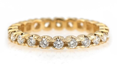 A diamond ring set with numerous brilliant-cut diamonds weighing a total of...