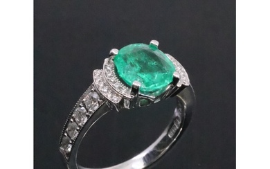 A fine emerald and diamond cluster ring finger size P half t...