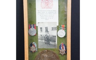 A framed and glazed World War Two medal group of four to inc...