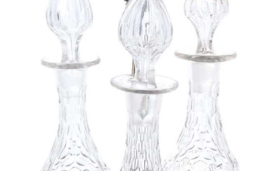 A good quality Dixon silver plated three-bottle decanter stand, with cut glass decanters