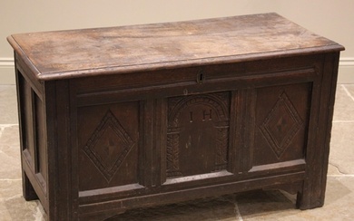 A late 17th/early 18th century oak coffer, the moulded two p...