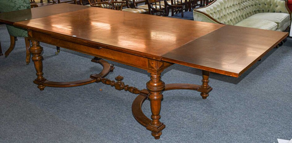 A late 19th century French walnut extending dining table,...