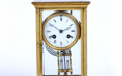 A late 19th century brass four glass mantel clock