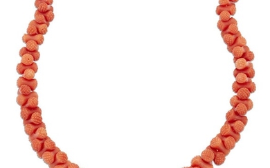 A late 19th century coral necklace, composed of a series of graduated waisted coral, corallium rubrum, with carved domed circular terminals, to a gilt barrel clasp with chevron decoration and bead detail, length 44.0cm