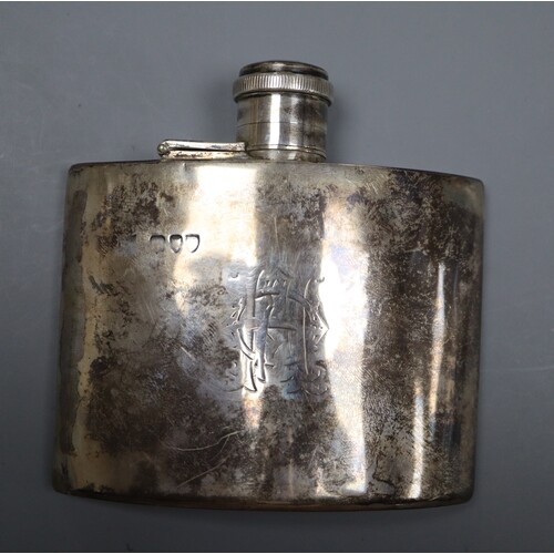 A late Victorian curved silver hip flask, marks rubbed, Lond...