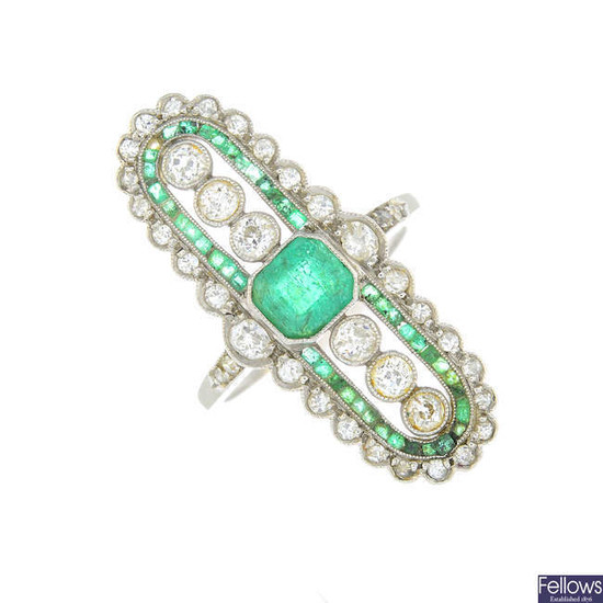 A mid 20th century gold emerald and diamond ring.