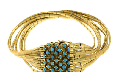A multi-strand bracelet, with turquoise clasp.