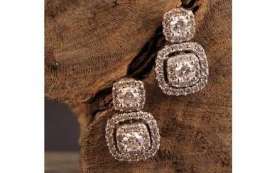 A pair diamond and 10ct white gold drop earrings, set in a h...
