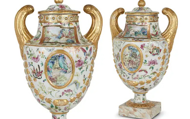 A pair of Chinese export famille rose pistol-handled urns and covers Qing...