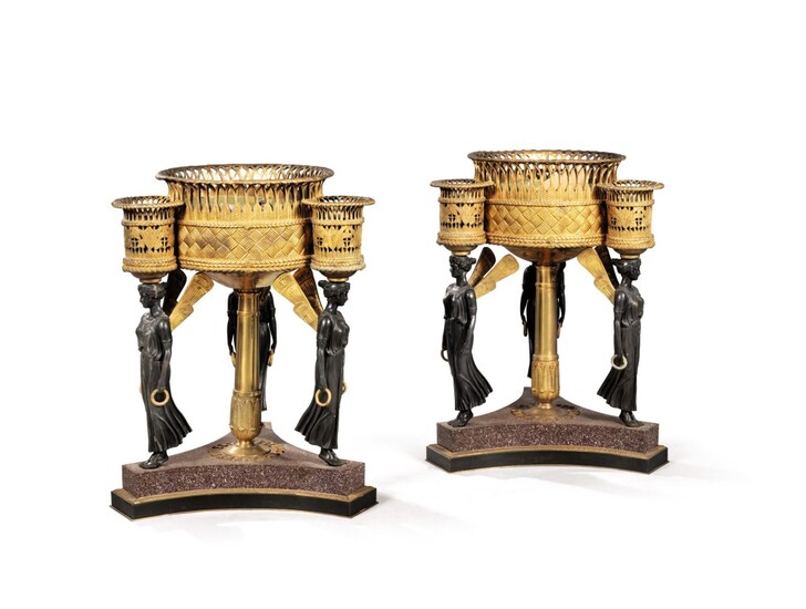 A pair of Empire style gilt and patinated bronze and porphyry jardinières after Pierre-Philippe Thomire