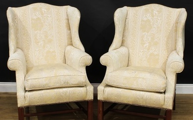 A pair of contemporary George III style wing chairs, each wi...