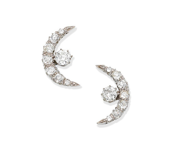 A pair of diamond crescent earrings