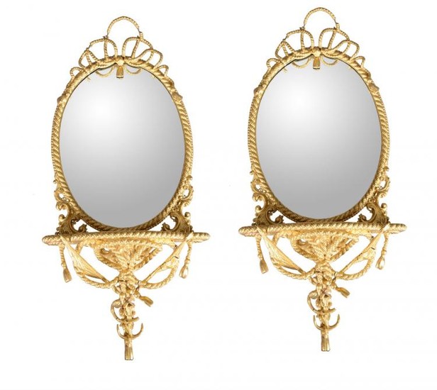 A pair of giltwood and composition mirrored wall brackets