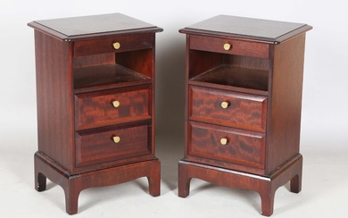 A pair of late 20th century Stag hardwood bedside chests, each with slide, open shelf and two drawer