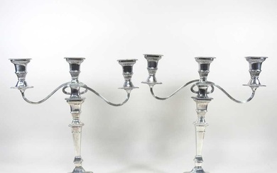 A pair of silver plated twin branch table candelabra, with...