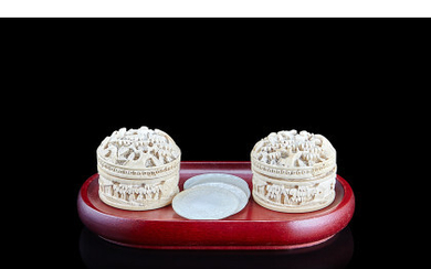 A pair of small ivory round boxes with chips, later wood base (defects) China, 19th century (d. 3.2 cm.) ...