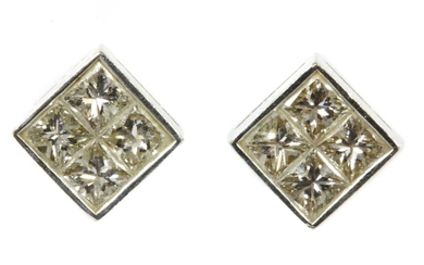 A pair of white gold diamond earrings