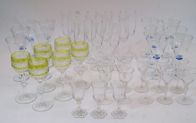 A quantity of drinking glasses, 20th century clear and coloured glass, to include: a set of six St Louis crystal wine goblets in the 'Harlequin' pattern, acid green and clear glass, 18cm high; a set of twelve wine glasses with blue glass knopps...
