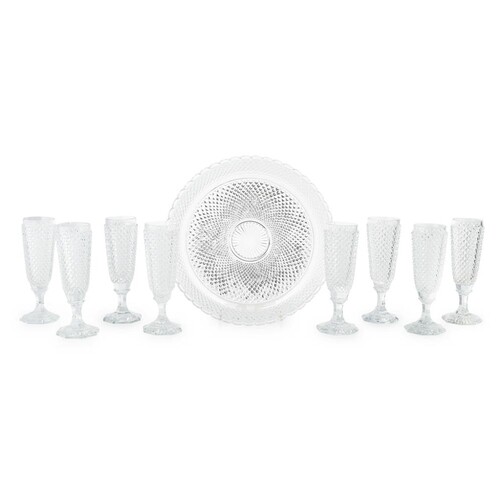 ATTRIBUTED TO BACCARAT, A SET OF EIGHT HOBNAIL CUT CHAMPAGNE...