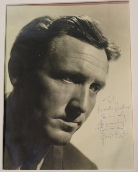AUTOGRAPH. A black and white photograph of Spencer Tracy, signed, dedicated and dated 'Jan 1938' by