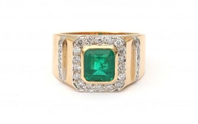 An 18 carat yellow gold emerald and diamond ring. Set with a rectangular faceted cut emerald in the center of ca. 1.40 ct. surrounded by eighteen brilliant cut diamonds. Another ten diamonds are set in the shank, ca. 0.56 ct. in total, ca G-H, ca. SI...